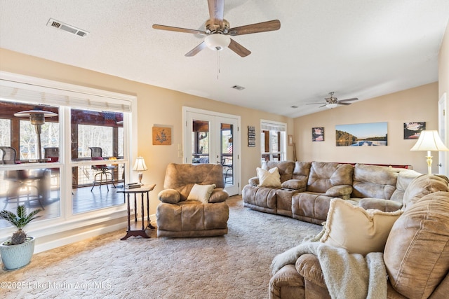 57 Lakeview Pt, Alexander City, AL 35010 - carpeted living area with ceiling fan, lofted ceiling, and french doors