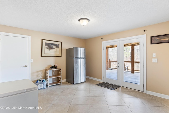 57 Lakeview Pt, Alexander City, AL 35010 - doorway to outside with french doors, a textured ceiling, and light tile patterned flooring