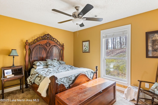 57 Lakeview Pt, Alexander City, AL 35010 - bedroom with carpet, a textured ceiling, and ceiling fan