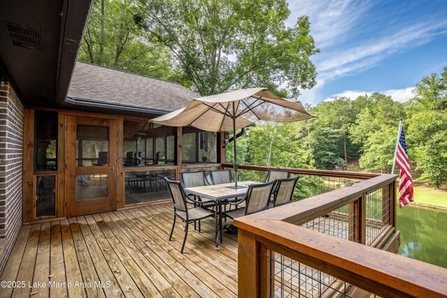 57 Lakeview Pt, Alexander City, AL 35010 - wooden deck featuring outdoor dining area and a forest view
