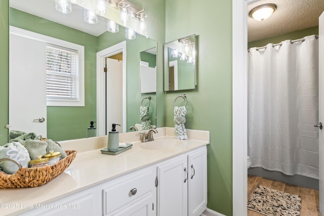 57 Lakeview Pt, Alexander City, AL 35010 - full bath featuring vanity and wood finished floors