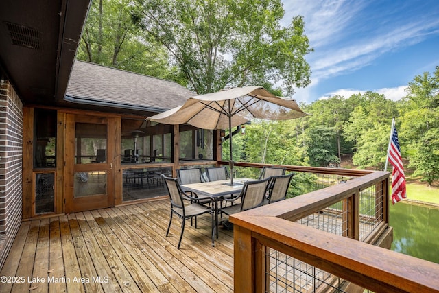 57 Lakeview Pt, Alexander City, AL 35010 - wooden deck featuring outdoor dining area and a forest view