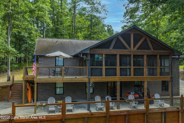 57 Lakeview Pt, Alexander City, AL 35010 - back of house featuring a sunroom, outdoor dining area, french doors, a patio, and a deck