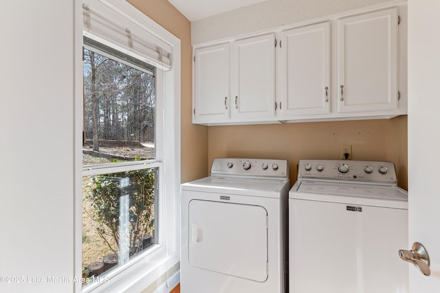 57 Lakeview Pt, Alexander City, AL 35010 - laundry area featuring separate washer and dryer and cabinet space