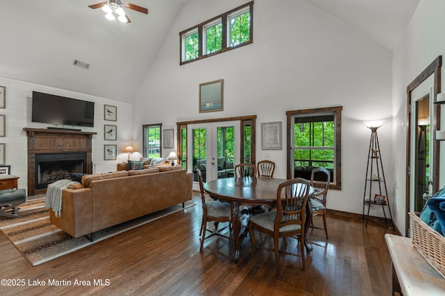254 Paces Way, Dadeville, AL 36853 - dining room featuring high vaulted ceiling, a fireplace, wood-type flooring, a ceiling fan, and french doors