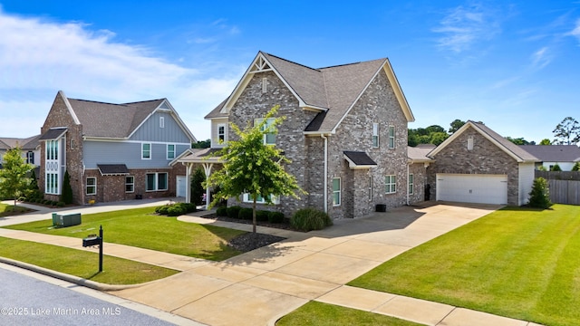 2409 Meadow Cove Rd, Auburn, AL 36832 - craftsman-style house featuring driveway, an attached garage, brick siding, and roof with shingles