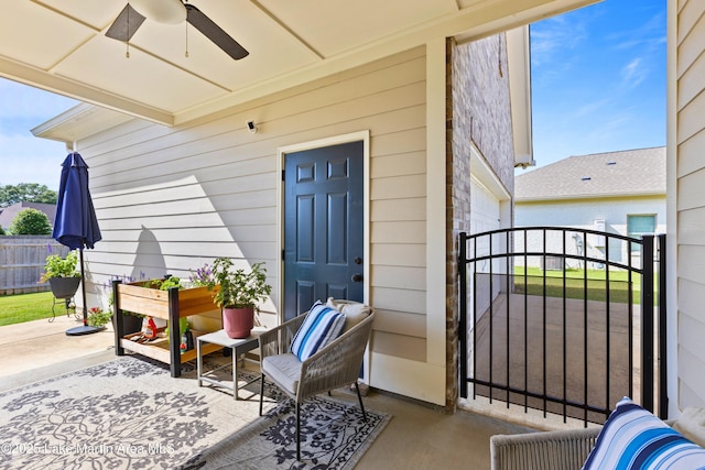 2409 Meadow Cove Rd, Auburn, AL 36832 - view of exterior entry with ceiling fan and a gate