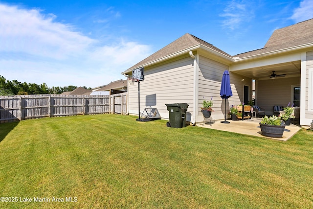 2409 Meadow Cove Rd, Auburn, AL 36832 - fenced backyard with a ceiling fan and a patio