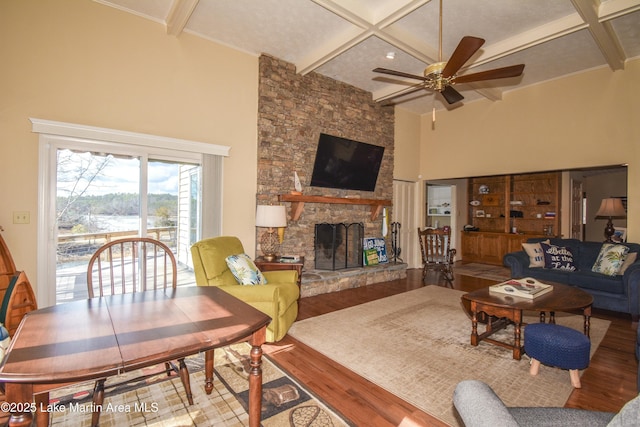 127 Ridge Crest Dr, Jacksons Gap, AL 36861 - living area with wood finished floors, coffered ceiling, a ceiling fan, a fireplace, and beamed ceiling