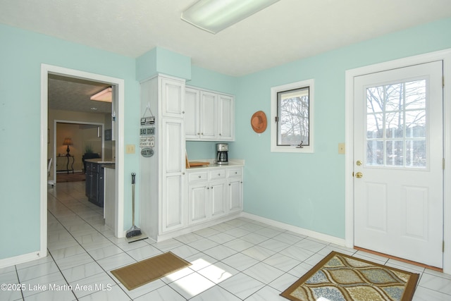127 Ridge Crest Dr, Jacksons Gap, AL 36861 - entryway with baseboards and light tile patterned floors