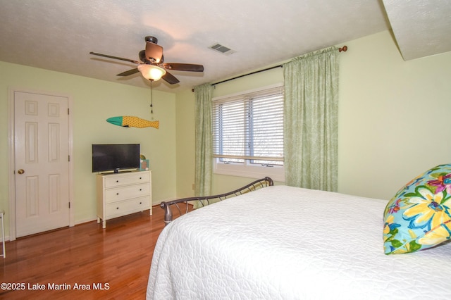 127 Ridge Crest Dr, Jacksons Gap, AL 36861 - bedroom with wood finished floors and ceiling fan