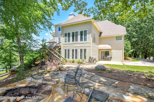 127 Ridge Crest Dr, Jacksons Gap, AL 36861 - back of house with an outdoor fire pit, a chimney, stairs, and a patio area