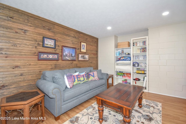 127 Ridge Crest Dr, Jacksons Gap, AL 36861 - living room with light wood-type flooring, recessed lighting, and wood walls