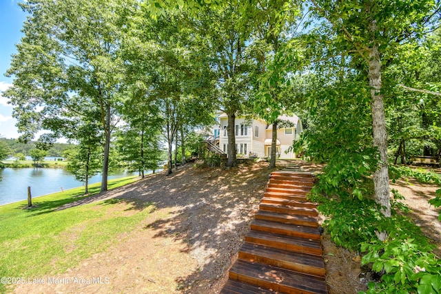 127 Ridge Crest Dr, Jacksons Gap, AL 36861 - view of front of home with stairs, a water view, and a front lawn