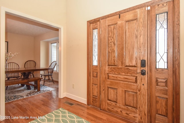 127 Ridge Crest Dr, Jacksons Gap, AL 36861 - entryway with plenty of natural light, wood finished floors, and baseboards