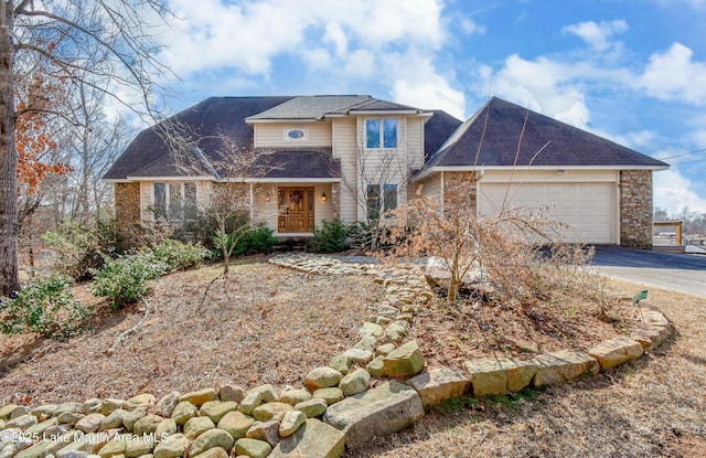 front of property with a garage