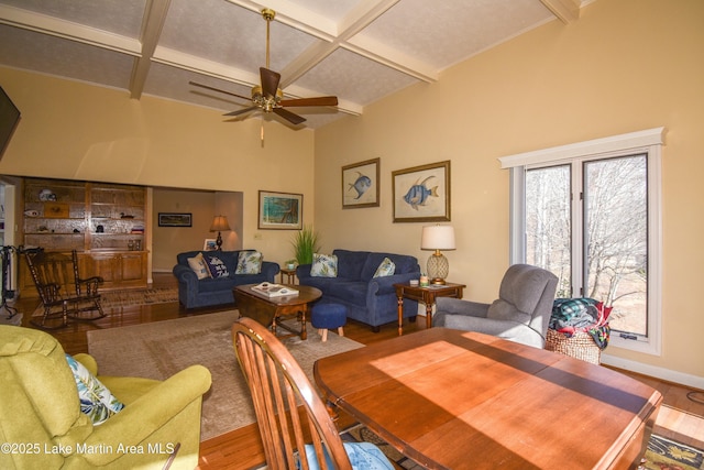 127 Ridge Crest Dr, Jacksons Gap, AL 36861 - dining space featuring coffered ceiling, wood finished floors, ceiling fan, beamed ceiling, and baseboards