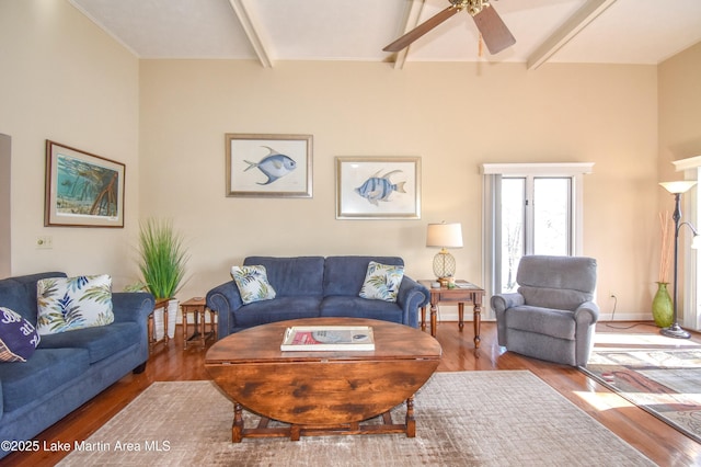 127 Ridge Crest Dr, Jacksons Gap, AL 36861 - living area featuring beam ceiling, a ceiling fan, wood finished floors, and baseboards