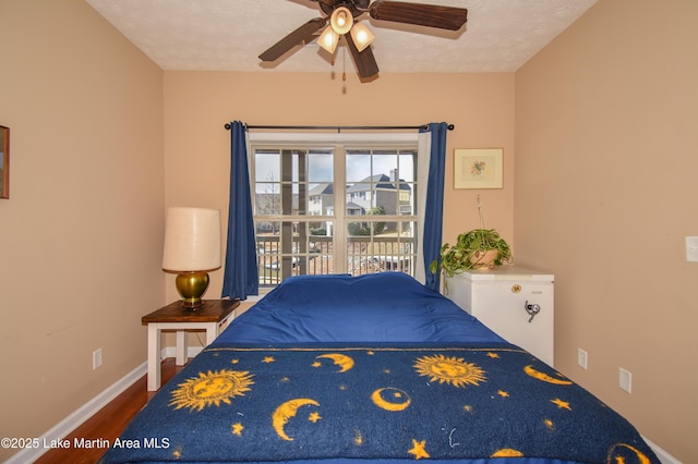 bedroom featuring hardwood / wood-style flooring and a textured ceiling