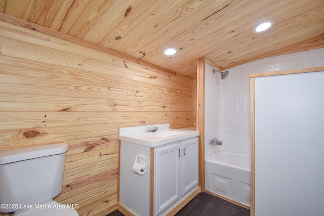 full bathroom with vanity, wood ceiling, toilet, and washtub / shower combination