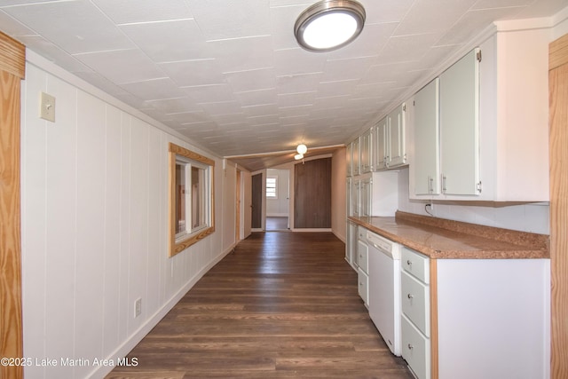 corridor with dark hardwood / wood-style flooring