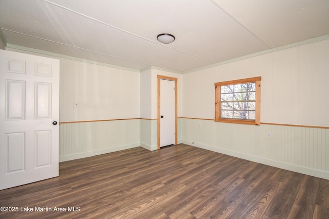 spare room featuring dark hardwood / wood-style floors