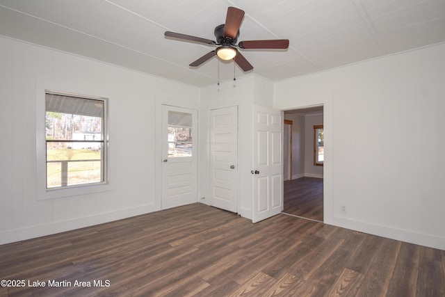 unfurnished room featuring ceiling fan and dark hardwood / wood-style flooring