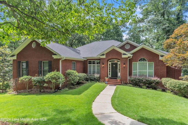 ranch-style home with a front yard