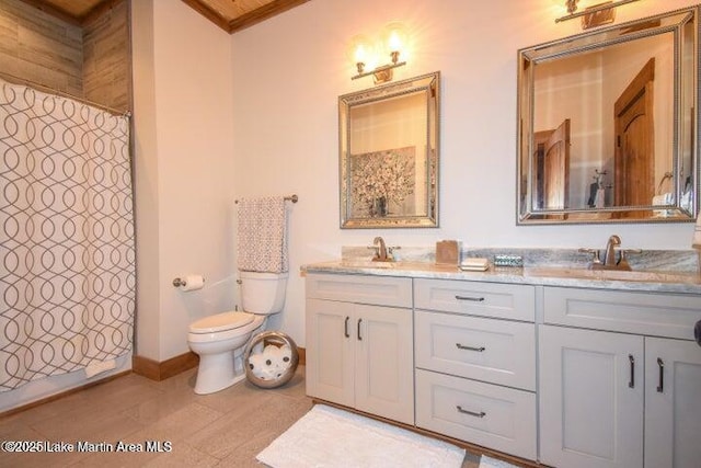 bathroom with a shower with curtain, vanity, crown molding, and toilet