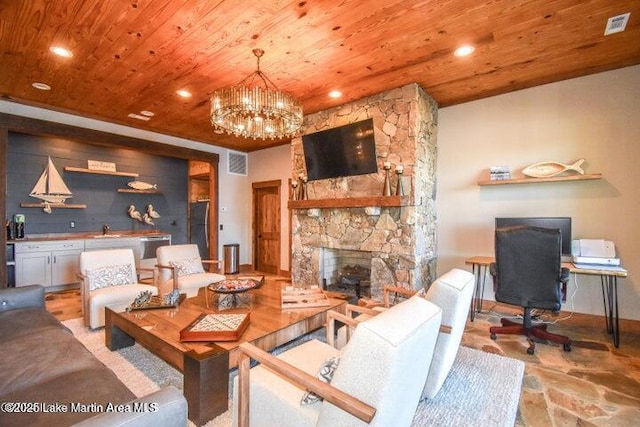 living room featuring sink, an inviting chandelier, wooden ceiling, and a fireplace