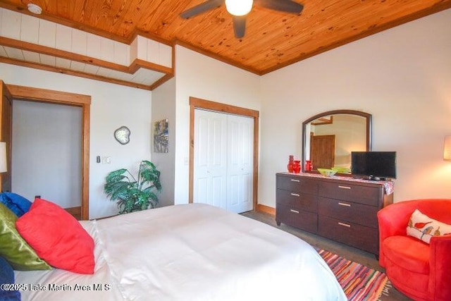 bedroom featuring ceiling fan, a closet, and wooden ceiling