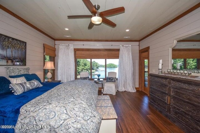 bedroom with ornamental molding, wooden walls, wooden ceiling, and dark hardwood / wood-style flooring