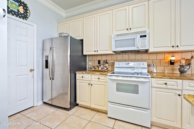 876 Ridge Rd, Dadeville, AL 36853 - kitchen featuring white appliances, ornamental molding, cream cabinets, decorative backsplash, and light tile patterned floors