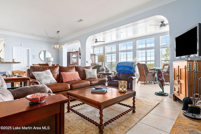 876 Ridge Rd, Dadeville, AL 36853 - living room featuring ceiling fan, light tile patterned floors, ornamental molding, arched walkways, and a chandelier