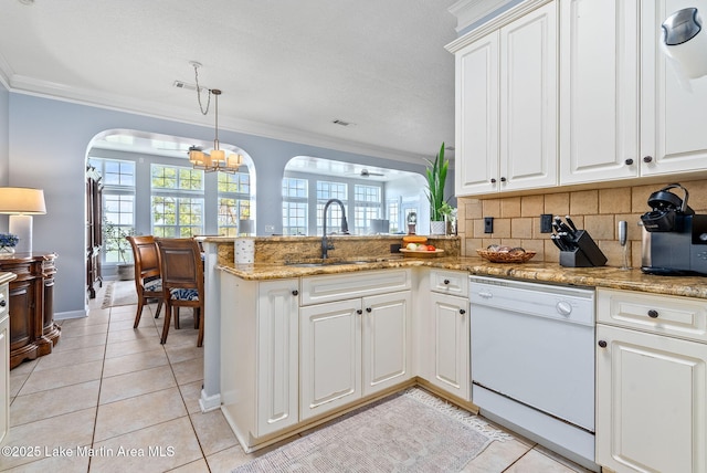 876 Ridge Rd, Dadeville, AL 36853 - kitchen featuring dishwasher, arched walkways, crown molding, a peninsula, and light tile patterned flooring