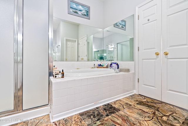 876 Ridge Rd, Dadeville, AL 36853 - bathroom with a stall shower, marble finish floors, and a garden tub