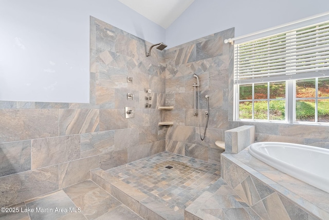 876 Ridge Rd, Dadeville, AL 36853 - bathroom with tiled shower, a garden tub, and vaulted ceiling
