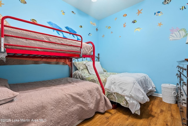 876 Ridge Rd, Dadeville, AL 36853 - bedroom with wood finished floors and wallpapered walls