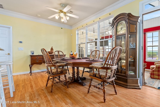 876 Ridge Rd, Dadeville, AL 36853 - dining area with light wood finished floors, a ceiling fan, and crown molding