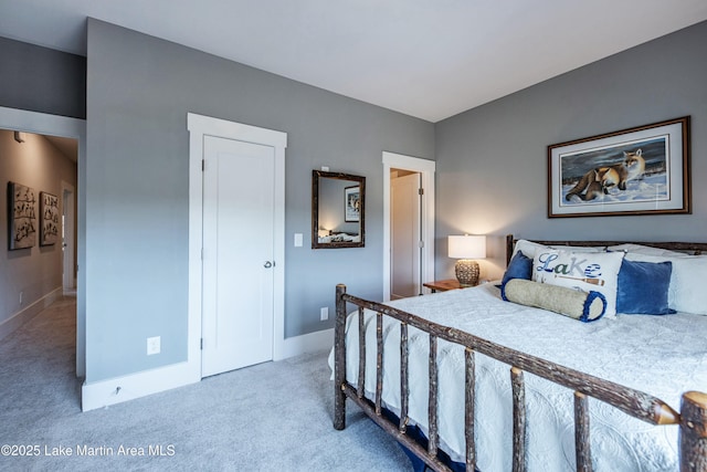 bedroom featuring light carpet