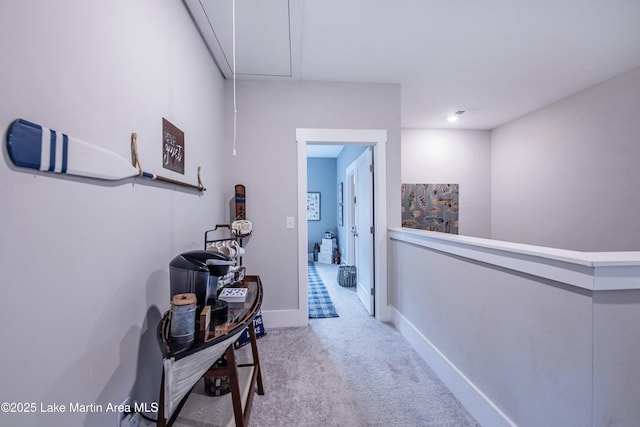 hallway featuring light carpet