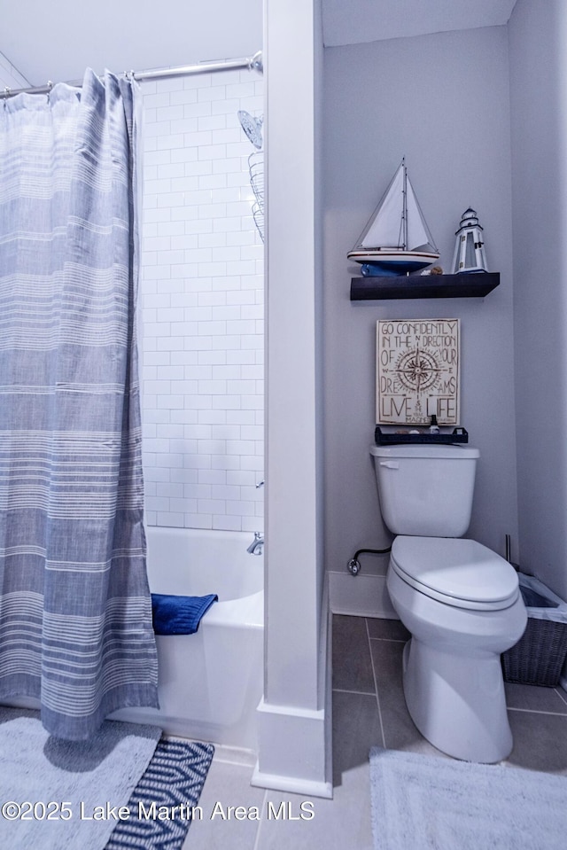 bathroom with tile patterned floors, toilet, and shower / tub combo