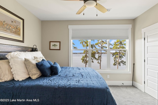 bedroom featuring carpet flooring, multiple windows, and ceiling fan