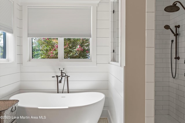 bathroom featuring plus walk in shower