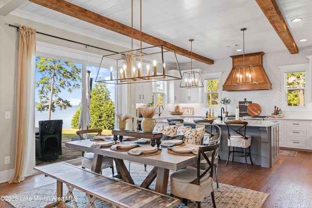 dining area featuring a chandelier, dark hardwood / wood-style floors, and plenty of natural light