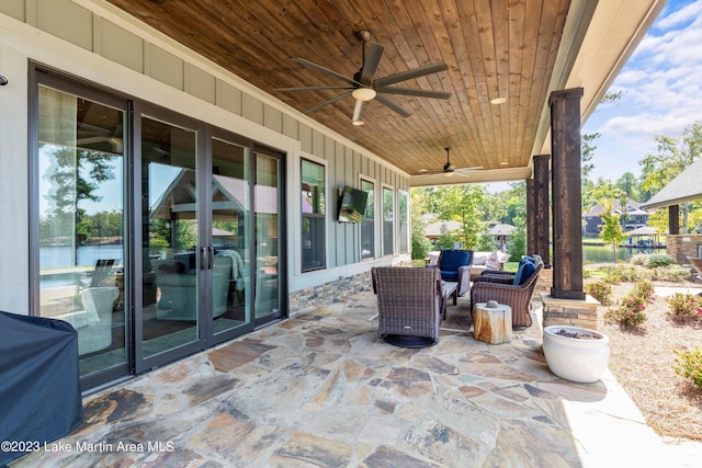 view of patio with french doors and ceiling fan