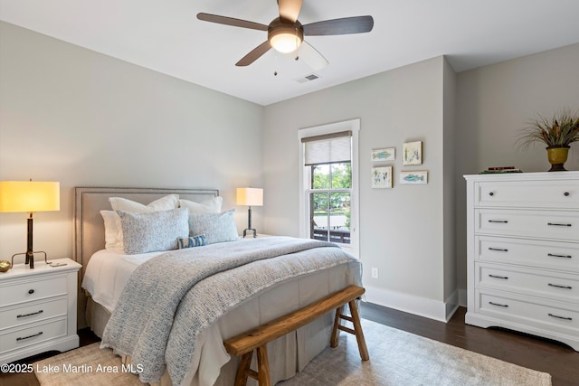 391 Old Jay Rd, Eclectic, AL 36024 - bedroom with wood finished floors, baseboards, and ceiling fan