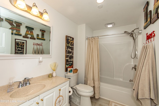 full bathroom featuring shower / bath combination with curtain, vanity, and toilet