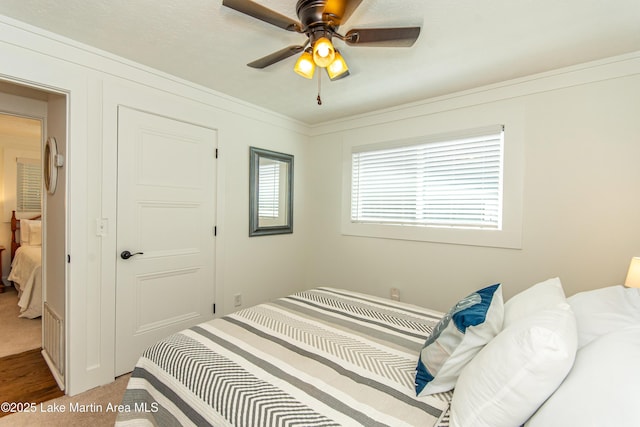 bedroom featuring carpet floors and ceiling fan