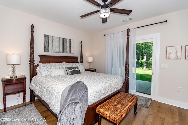 bedroom featuring ceiling fan, wood-type flooring, and access to exterior